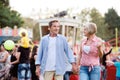 Senior couple at the fun fair, holding hands, walking. Royalty Free Stock Photo