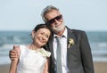 Senior couple getting married at the beach Royalty Free Stock Photo