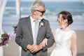 Senior couple getting married at the beach