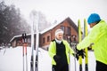 Senior couple getting ready for cross-country skiing. Royalty Free Stock Photo