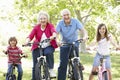 Senior couple with grandchildren on bikes Royalty Free Stock Photo