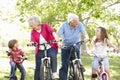 Senior couple with grandchildren on bikes Royalty Free Stock Photo