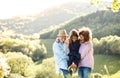 Senior couple with granddaughter outside in spring nature, relaxing and having fun. Royalty Free Stock Photo