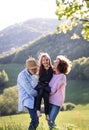 Senior couple with granddaughter outside in spring nature, relaxing and having fun. Royalty Free Stock Photo