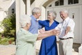 Senior couple greeting friends Royalty Free Stock Photo