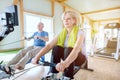 Senior couple in the gym on a rowing machine Royalty Free Stock Photo