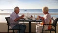 Senior couple have breakfast at the hotel outdoor