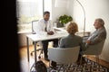 Senior Couple Having Consultation With Male Doctor In Hospital Office Royalty Free Stock Photo