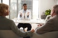 Senior Couple Having Consultation With Male Doctor In Hospital Office Royalty Free Stock Photo