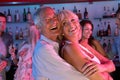 Senior Couple Having Fun In Busy Bar Royalty Free Stock Photo