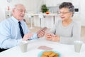 Senior couple having fun playing cards at home Royalty Free Stock Photo