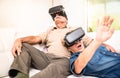 Senior couple having fun together with virtual reality headset