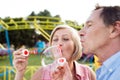 Senior couple having a good time at the fun fair Royalty Free Stock Photo