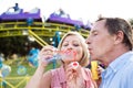 Senior couple having a good time at the fun fair Royalty Free Stock Photo