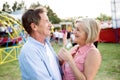 Senior couple having a good time at the fun fair Royalty Free Stock Photo