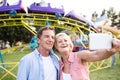 Senior couple having a good time at the fun fair Royalty Free Stock Photo