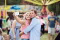 Senior couple having a good time at the fun fair Royalty Free Stock Photo
