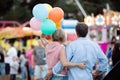 Senior couple having a good time at the fun fair Royalty Free Stock Photo