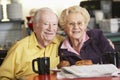 Senior couple having morning tea together Royalty Free Stock Photo