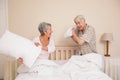 Senior couple having a pillow fight Royalty Free Stock Photo