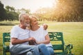 Senior couple having romantic and relax time in a park Royalty Free Stock Photo