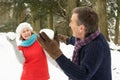 Senior Couple Having Snowball Fight Royalty Free Stock Photo