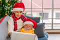 Senior couple having video call with family on laptop during Christmas eve Royalty Free Stock Photo