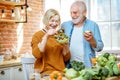 Senior couple with healthy food at home