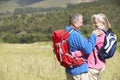 Senior Couple On Hike Through Beautiful Countryside Royalty Free Stock Photo