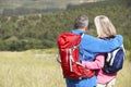 Senior Couple On Hike Through Beautiful Countryside Royalty Free Stock Photo