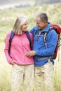 Senior Couple On Hike Through Beautiful Countryside Royalty Free Stock Photo