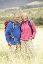 Senior Couple On Hike Through Beautiful Countryside