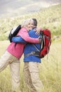 Senior Couple On Hike Through Beautiful Countryside Royalty Free Stock Photo