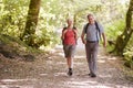 Senior Couple Hiking Along Woodland Path In Lake District UK Together Royalty Free Stock Photo