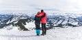 Senior couple is hiking in alpine snow winter mountains enjoying panorama view. Allgau, Bavaria, Germany. Royalty Free Stock Photo