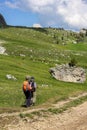 Senior couple hiking in the Dolomites mountain