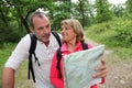 Senior couple hiking and looking at map Royalty Free Stock Photo