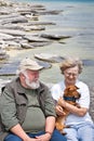 Senior couple holding a dachshund