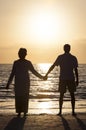 Senior Couple Holding Hands Sunset Tropical Beach Royalty Free Stock Photo