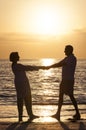 Senior Couple Holding Hands Sunset Tropical Beach Royalty Free Stock Photo