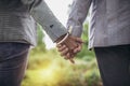 Senior couple holding hands together on the background Royalty Free Stock Photo