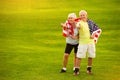 Senior couple holding USA flag. Royalty Free Stock Photo