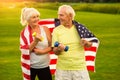 Senior couple holds dumbbells. Royalty Free Stock Photo