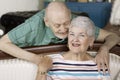 SeniorCouple Holding Embracing with smiles