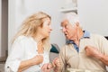 SENIOR COUPLE AT HOME IN THE KITCHEN Royalty Free Stock Photo