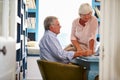 Senior Couple In Home Office Looking At Laptop Royalty Free Stock Photo