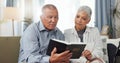 Senior, couple and home reading bible and talking of faith, god or helping with spiritual guide of scripture on sofa Royalty Free Stock Photo