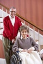 Senior couple at home, woman in wheelchair