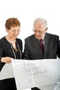 Senior couple and house plans Royalty Free Stock Photo