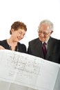 Senior couple and house plans Royalty Free Stock Photo
